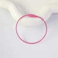 Pink coated stainless steel wire key ring with secure screw closure on a ceramic plate - Rose Red
