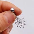 Macro shot of silver belly ring featuring leaf-shaped marquise cubic zirconia crystals - Silver Triple Leaf Style (JE0428K)