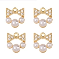 Detailed view of four golden bow charms with white pearls and sparkling rhinestones - Bowknot Dangle Pearl (px1086-29)