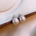 Macro shot of 14K gold plated crown pearl earrings with sparkling zircon gemstones - 12# Silver Needle White Pearl Crown Design Stud Earrings