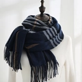 Classic navy and camel plaid cashmere-like warm scarf with tassels on display - Blue