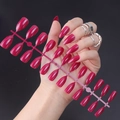 Macro detail of glossy dark magenta pointed false nails held by hand on black background - Glossy Deep Rose (JJL-30)