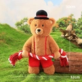 Plush brown bear dog toy with hat and red overalls holding red-white cotton rope - Bear in Overalls