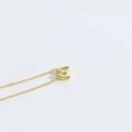 Minimalist 18K gold plated necklace featuring a round 3D letter M pendant on a fine chain - Letter W