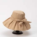 Detailed view of beige sun hat featuring vertical stripes and a decorative bow ornament - M (56-58cm) / Khaki