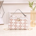 White leather handbag with pink clover diamond print and golden chain strap - White
