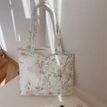 Detail of pink floral quilted cotton tote bag with vintage label and soft shadows - Pink Large Floral