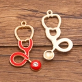 DIY medical charms set featuring red enamel stethoscope pendant and gold镂空 hollow pendant - Large Stethoscope - Red Enamel/Rhinestone / Gold/Red