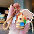 Capybara plush keychain in a barrel with bird and brown woven lanyard strap - Relaxed Capybara
