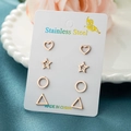 Detail of four rose gold stainless steel earrings in heart, star, and geometric shapes - Geometric Combination Set / Rose Gold