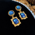 Vintage gold square earrings with blue gemstones displayed on black velvet - 115 Silver Pin-Blue Rhinestone Square