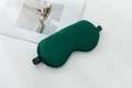 Dark green 22 momme silk eye mask with elastic strap and wash label on white background - Dark Green