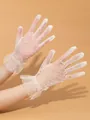 Elegant white lace polka dot gloves with feminine ruffled wrist detailing for bridal wear - One Size / Off White