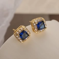 Minimalist square zircon stud earrings in 14k gold plating with deep blue center stone - Sapphire Blue