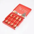 Macro detail of 4-piece rose gold Christmas spoon set in a festive red gift box package - Christmas Gift Box Set (A) (JH Christmas Spoon) / 4 Pieces (Gift Box) / Rose Gold