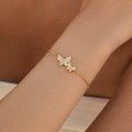 Adjustable gold butterfly bracelet with double zircon butterflies shown on a female wrist - Double Butterfly (KB0691)