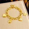 Gold-plated stainless steel chain bracelet with heart and flower charms on jewelry box - Gold Multi-Pendant Style(B1642)