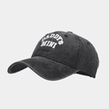 Detailed close-up of DADDY'S MINI embroidery on a distressed grey washed baseball cap - Adjustable / Black