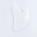 White heart-shaped resin facial massage tool with smooth ergonomic curves and polished finish - Resin / White