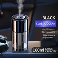 Classic black car humidifier with 160ml water tank and metallic lid emitting fine mist - Rechargeable With Start-Stop / Ocean