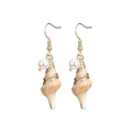 Detail of golden seashell earrings featuring natural shell texture and white pearls - Cowrie Style (YE-1057-A)
