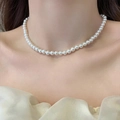 Elegant white pearl necklace for women featuring round glossy pearls on a neck model - 5MM Pearl + Gold Tail Chain / Cream