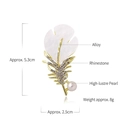 Elegant gold feather brooch with white acrylic petals, rhinestones and a white pearl accent - White Feather