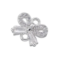 Macro shot of bow-shaped pendant with sparkling zircon inlays for DIY jewelry making - Silver Bowknot