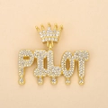 Macro view of gold-plated PILOT letter pendant with crown and dripping rhinestones - Gold PILOT (Crown)