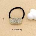 Close-up of elegant black hair tie with gold crystal rectangle ornament 1.5x4cm size - Golden Rectangle Rhinestone