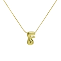 Detailed view of polished 18k gold puffy bubble letter F pendant with box chain - Letter F