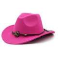 Detail of rose pink felt cowboy hat featuring dark braided band and vintage metal ornament - Rose Red