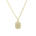 Macro detail of gold-plated square pendant with sparkling cubic zirconia letter inlay - Necklace O
