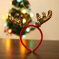Serre-tête de Noël avec bois de renne dorés et houx sur fond bois sombre - Or Pailleté