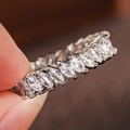 Macro view of marquise-cut marquise stones in a silver prong setting eternity ring - US 6 / Marquise Cut
