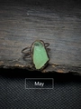 Macro detail of vintage adjustable ring featuring an irregular green May birthstone - May - Green Fluorite