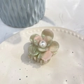 Floral acetate hair claw with pink gradient petals and a white pearl center on a ceramic plate - 5.3cm / Gray Green Mermaid