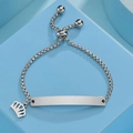 Detail of adjustable silver box chain bracelet with rectangle ID tag and crown charm - Steel Crown Style