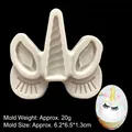 Unicorn silicone mold for fondant and chocolate featuring horn, ears, and closed eyes - Gray