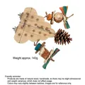 Detail view of bird toy platform with pine cones and colorful shredder paper - Tree Stand + String (Including 16 Corks) / Natural Wood Color