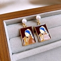 Detail of enamel earrings featuring Girl with a Pearl Earring and a cat on a jewelry tray - Silver Earring Post Square Enamel Girl and Cat Pearl Stud Earrings