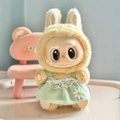 Plush yellow Labubu doll wearing a light green daisy embroidered lace dress - Green Daisy Pendant Strap / First And Second Generation Keychains Are Compatible With La Cloth Dolls. Dolls Not Included.