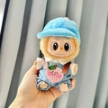 Brown plush doll wearing blue denim overalls with peach embroidery and a blue cap - Two-piece Set Of Pink Peach-colored Wool Overalls + Blue Bread Baseball Cap / First And Second Generation Keychains Are Compatible With La Cloth Dolls. Dolls Not Included.