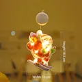 Light-up Santa Claus window decoration with LED skiing figure and warm yellow light - Small Skiing Santa / Small