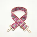 Close-up of ethnic geometric woven strap with gold metal buckles and adjustable slider - Gold Buckle / S2 Rose Red