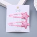 Set of two pink glitter star hair clips on a white display card for girls - One Pair / Pink Star Pair