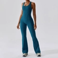 Slim fit flare leg yoga jumpsuit in deep peacock blue with a stylish halter neck design - S / Deep Sea Blue