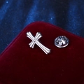 Silver metallic cross lapel pin with polished finish on a deep red velvet background - Silver Long Cross