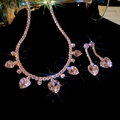 Dramatic shot of pink heart gemstone necklace and earring set on black background - Set-Pink