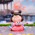 Cute Tang Dynasty style girl figurine reading a book in traditional pink and blue dress - Reading
